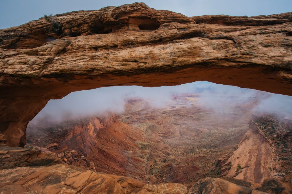 Arch rock formation in fog, Moab, Utah, USA