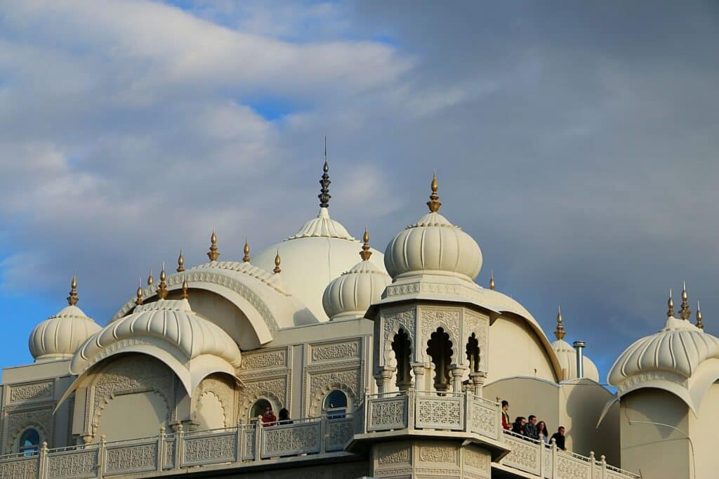 Striking architecture of top of beautiful Krishna Temple against summer sky in Spanish Fork, Utah.