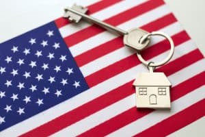 House with the flag of USA. Immigration to America.