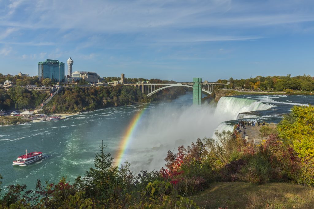 People admire the spectacle of the grandiose view of Niagara Falls from the American side